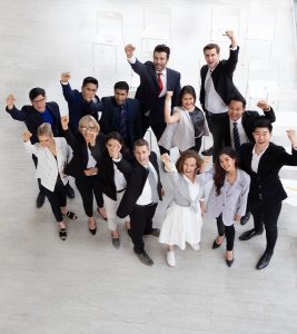 Excited office workers group photo